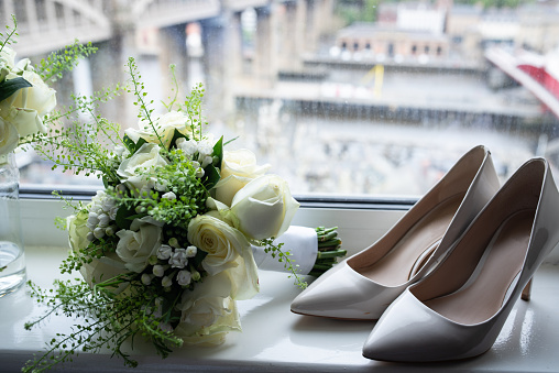 Wedding Shoes and Bouquet on Window Sill