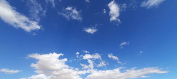 istock A blue sky with scattered clouds on a beautiful sunny day. 2130371422