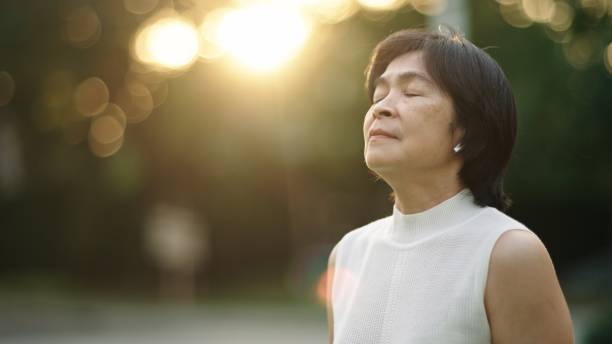 istock Asian woman doing breathing in nature. 2130391882