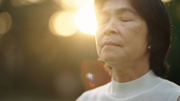 istock Asian woman doing breathing in nature. 2130391905