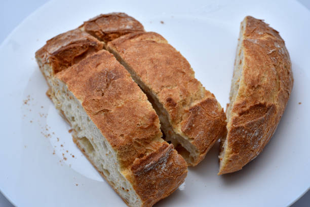 Fresh crusty bread. Sliced bread on a plate. Sandwiches.