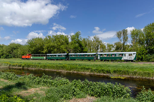 A station England UK. Diesel powered railway line in the English countryside. Station on a sunny day.