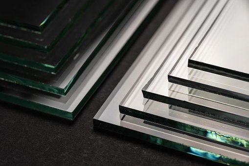 Sheets of Factory manufacturing tempered clear float glass panels cut to size.