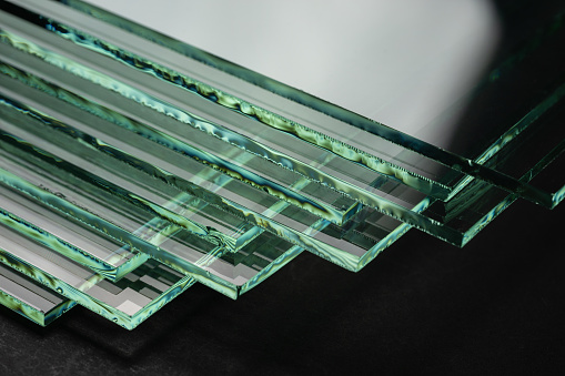 Glass factories produce glass used in buildings and homes. There are many different thicknesses and sizes.