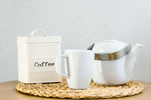 Close up shot of a vintage coffee set: carafe, mug and container with the word Coffee. Copy space. Horizontal.