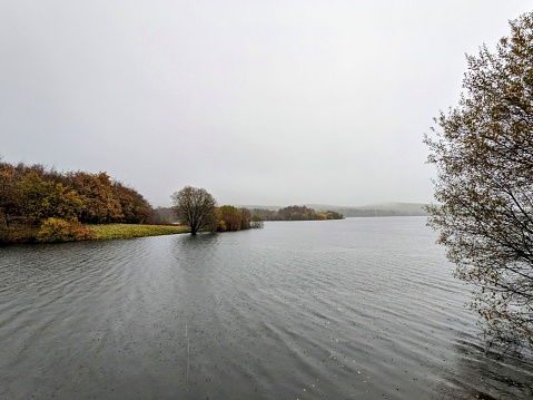 Walking around Watergrove reservoir near Rochdale and Whitworth. Taken on an absolutely soaking wet day in November, this reservoir still looks stunning in any weather. The scenery is real traditional English looking with muddy paths and wet vistas.