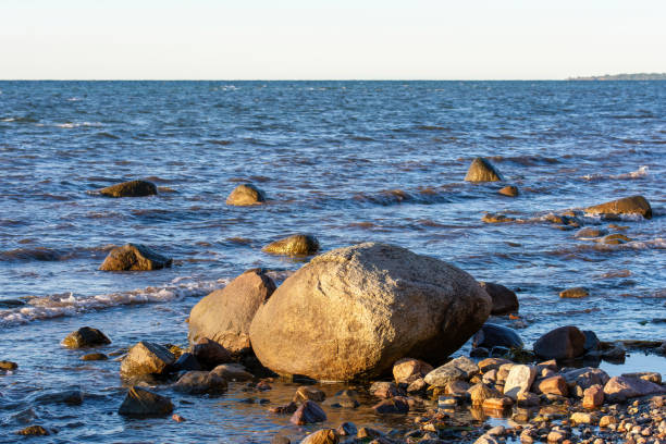 istock Big stones in the waves on a coast 2130558444