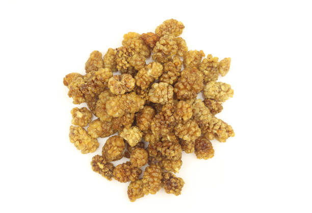 istock Pile of dry white mulberry fruit isolated on white backgorund 2130624616