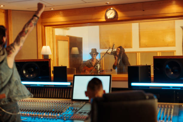 istock Producers supporting music artists in the music studio 2130626172