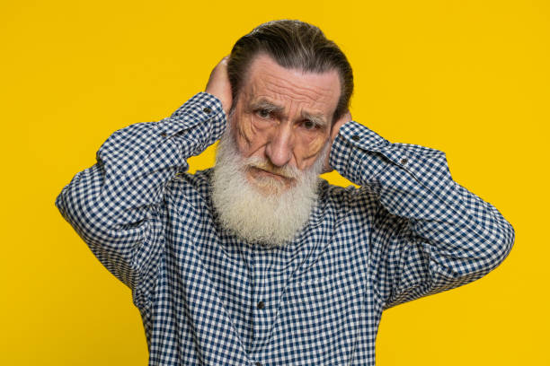 istock Annoyed irritated senior man covering ears gesturing no avoiding advice ignoring noise loud voices 2130658568