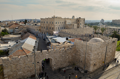 Jerusalem, Israel - December 18, 2019: Overhead shot revealing an entrance to Jerusalem's Old Town, where ancient stone walls encapsulate the historical charm and cultural allure of the vibrant city.