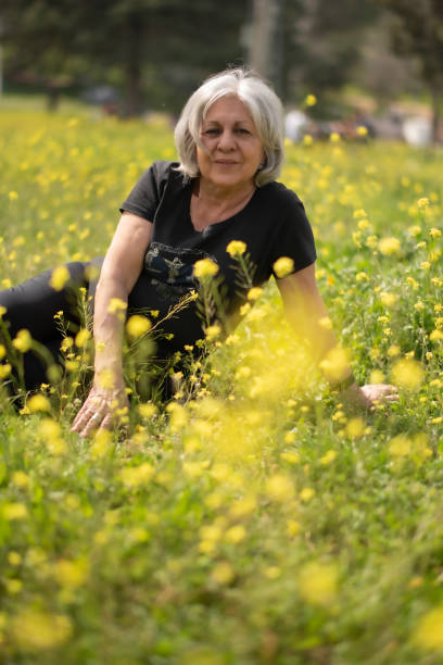 istock senior 70 years old woman enjoyng springtime 2130689847