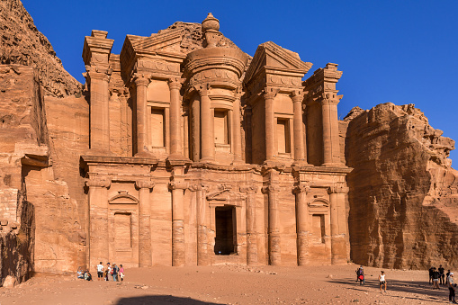 Petra, Jordan - November 3, 2022: People near Monastery or Ad Deir in ancient city of Nabatean kingdom
