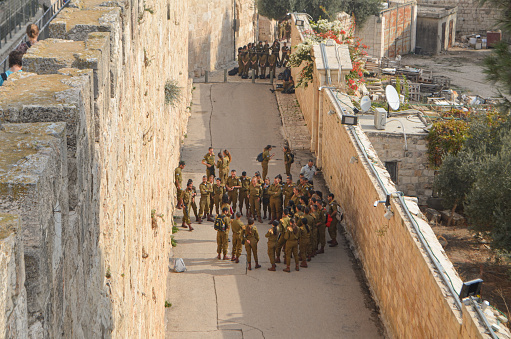 Jerusalem, Israel - December 19, 2019: Military school students practicing within the Old Town city walls, blending discipline with history in the heart of Jerusalem.