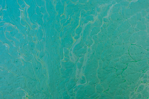 Beautiful fluid art natural luxury painting. Marbleized effect. Ancient oriental drawing technique. Teal, green, blue and turquoise colors. Abstract decorative marble texture.