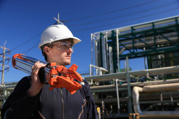 istock The male engineer carries a theodolite on his shoulder at the construction site. 2130758430