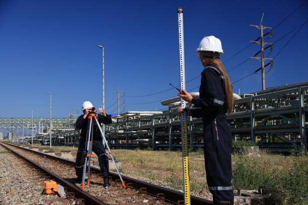 istock The surveyor and civil engineer collaborate using walkie-talkies and survey cameras to measure levels at the railway track construction site. 2130758940
