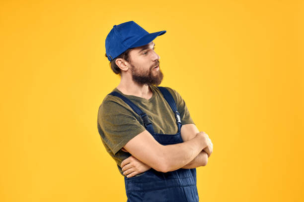 istock man in work uniform rendering service forklift work lifestyle yellow background 2130774492