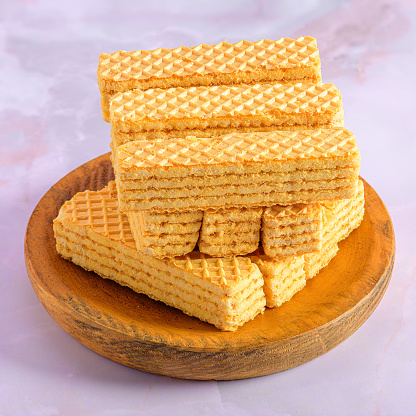 A Cream Biscuit Tower on Wooden Plate