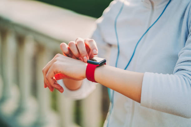 istock Sportswoman checking pulse on smartwatch 2130816142