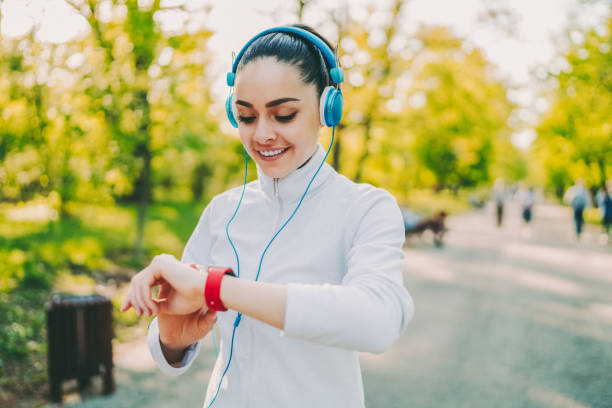 istock Sportswoman checking pulse on smartwatch 2130816665