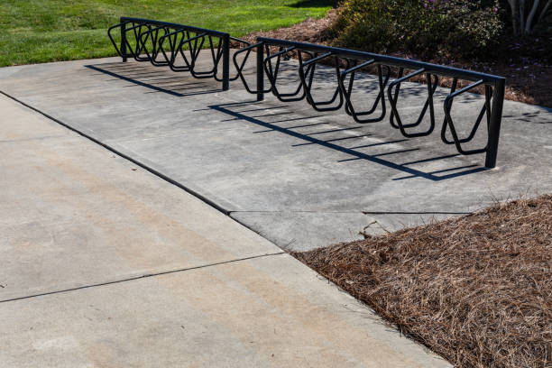 istock Empty black bike racksset on concrete pads, transportation metaphor 2130823936