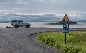 Adventure camper parked on a no over night parking spot on a scenic part of road in Iceland. Beautiful scenery overlanding vehicle parked.