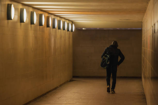 istock Person walking through underground corridor with lights, leading to siegessaule or victory monument in Berlin. 2130892111