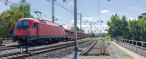 istock Train crash - modern electric locomotive tore the catenary system or electrical feed. Pantograph of a locomotive got caught in the wires and tore down the whole overhead line 2130892142