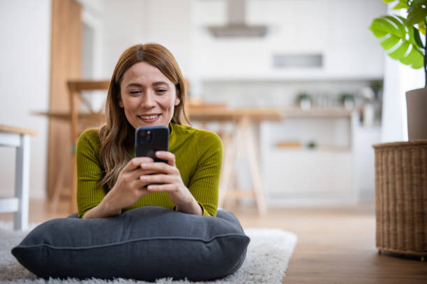istock Young woman using the mobile phone 2130894266