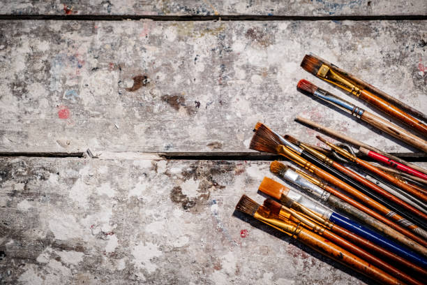 istock brushes on an artist's table as a canvas for an advertisement - artisan concept 2130914428