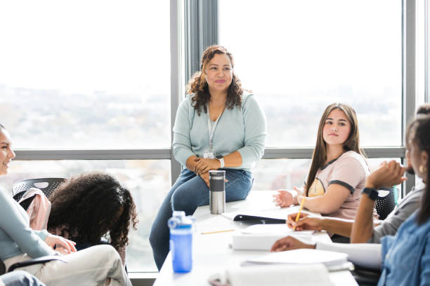 istock Female teacher moderates students' discussion 2130928460