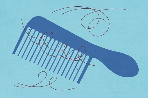 Illustration of a comb and scattered hair strands, symbolizing hair loss on a blue background