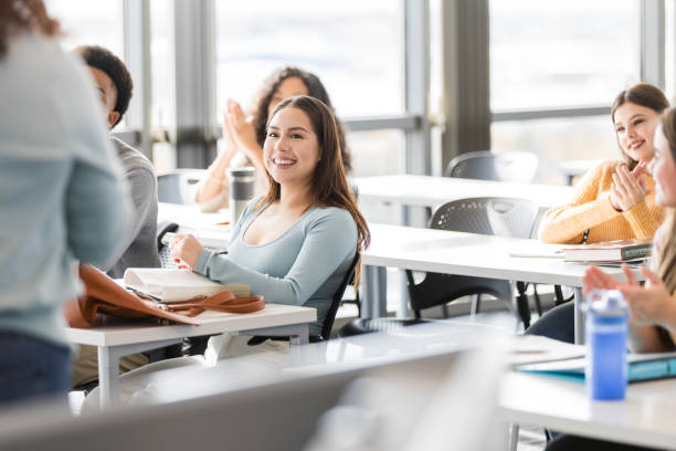 istock Diverse group of students clap after the unrecognizable speaker finishes their presentation 2130932126