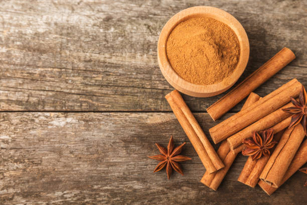 istock Cinnamon sticks and anise on a textured background. Cinnamon roll and star anise. Spicy spice for baking, desserts and drinks. Fragrant ground cinnamon.Place for text. copy space. 2130962842