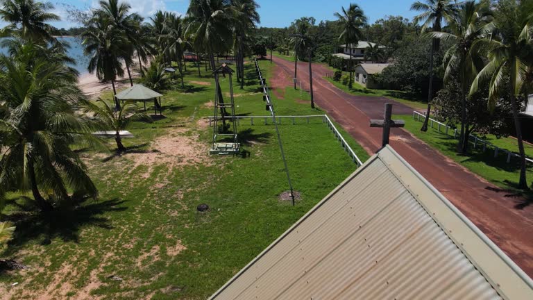 Aerial forward clip of abandoned church in remote tropical Australia.