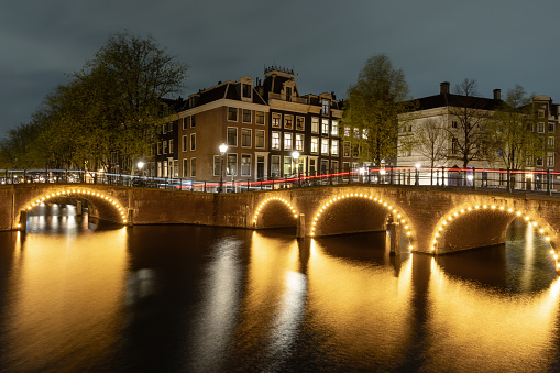 Old bridges crossing the Keizersgracht canal in Amsterdam, Netherlands