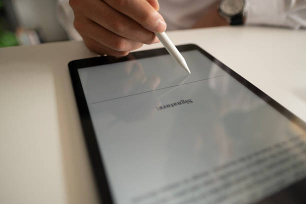 Businessman Signing Electronic Contract On Digital Tablet