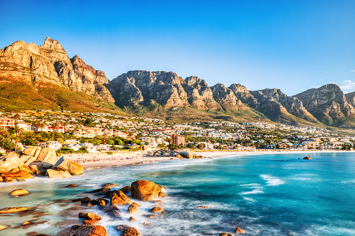 Scenic landscape of hidden treasure of Llandudno Beach with white sand and turquoise water, very close to Camps Bay and Cape Town, South Africa
