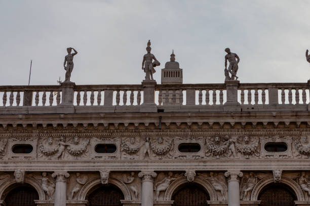 Venice, Italy - February 8, 2024: The Venetian lion normally has wings, very often holds a book below its paw, and sometimes is completed by a halo around its head. These three elements (wings, book, halo) reveal it as a symbol of Saint Mark the Evangelist, patron saint of the city. The latin sentence written on the book the lion is holding says: \