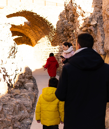 Family walk through Roman ruins in Tarragona