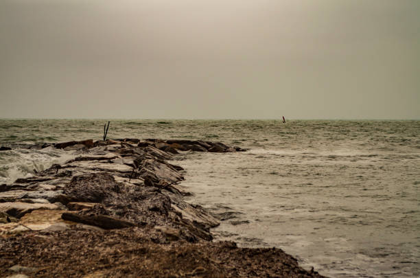 istock The coast and breakwater cliffs on a gray day 2131055262