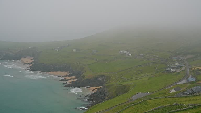 Idyllic view of Irish coast in summer at fog