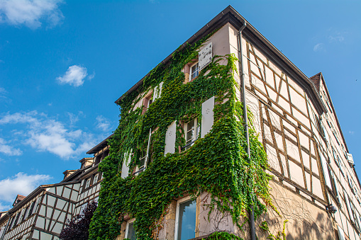 17. 07. 2023 Colmar, Alsace, France, traditional half-timbered houses and architectural details are tourist attraction.