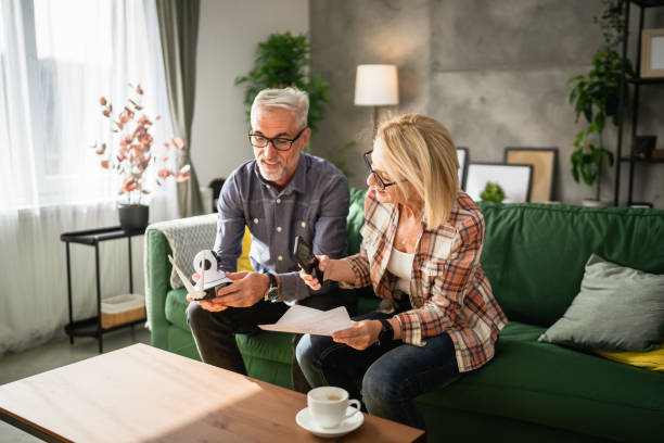 istock Couple at home connect and install cctv security surveillance camera 2131117791