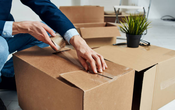 istock Man unpacking boxes new place emotions office manager 2131122491