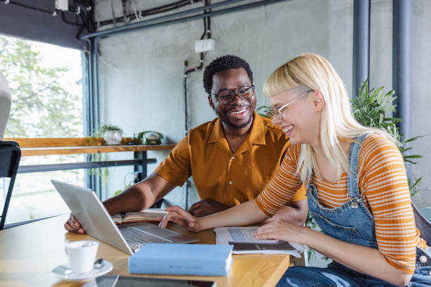 istock Young diverse students using laptop on laptop in co-working space 2131161025