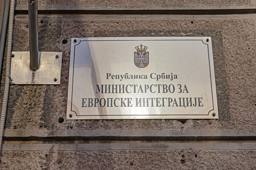 Belgrade, Serbia - February 28, 2024: Silver Plaque Cyrillic Script Ministry of European Integration at Government Building in Nemanjina Street.