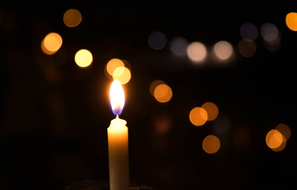 istock candle light in the dark with boke in the background 2131184576