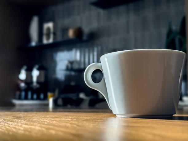 istock White cup of coffee on the table. 2131201796